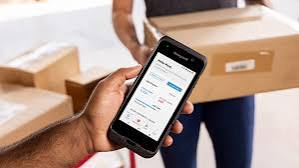 Worker using the Honeywell Productivity Hub on a mobile device in a distribution center